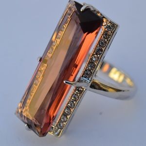 Silver ring with maroon Swarovski stones.